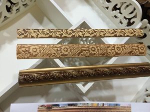 Various types of wooden painted moldings skirtings and cornices