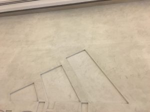 Concrete finish paint in Addidas shop